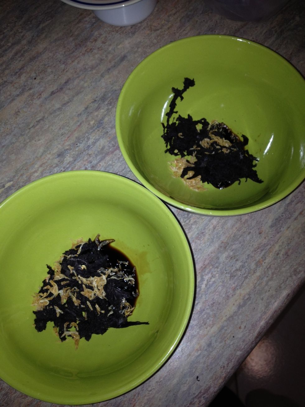 Add a couple of pinches of dried shrimp, some dried seaweed ripped up, a dash of soy sauce and a pinch of salt in each bowl.