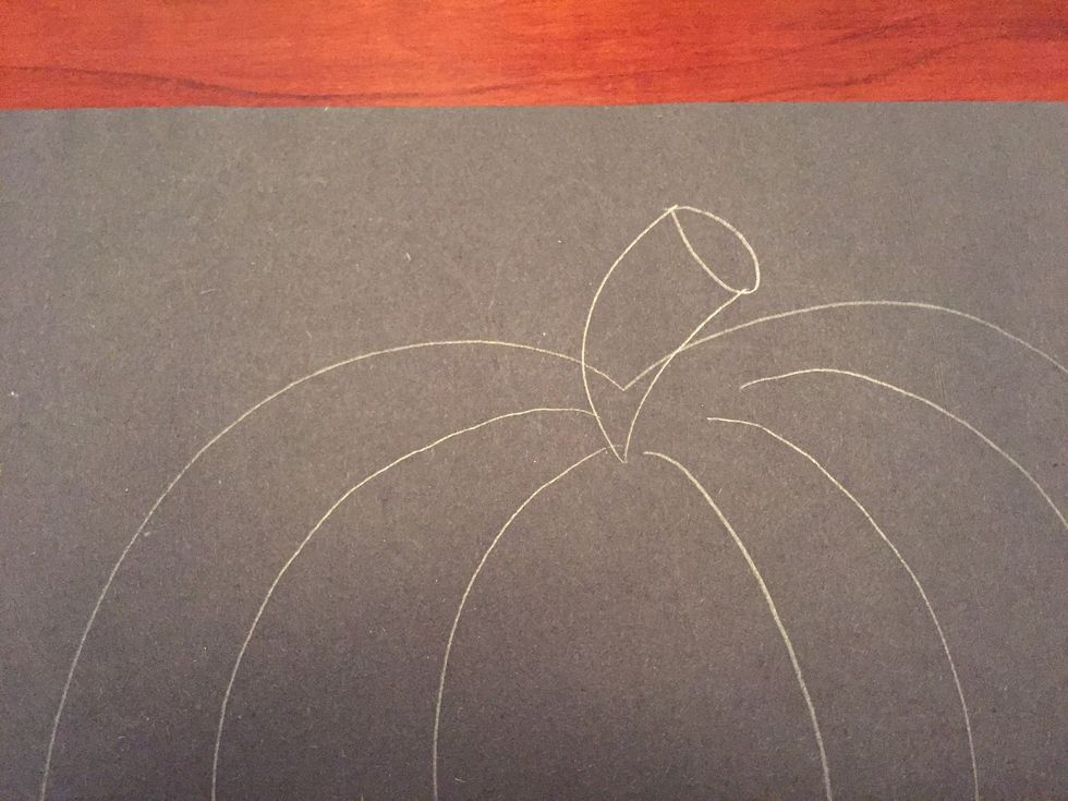 Add a curved line below the oval, creating a stem.