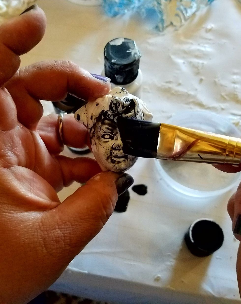 Add a darker color to all, Disc & R.A. I used black , water it down some and brush or dab it on You are getting it in the crevices and you will gently wipe it of the raised features of you pieces