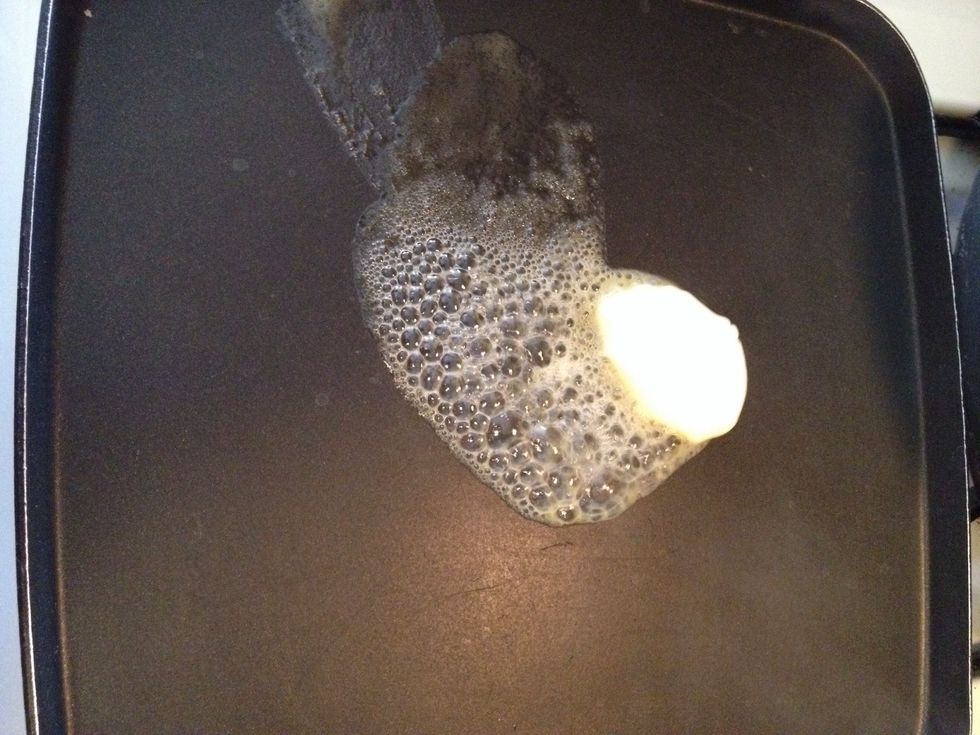 Add a dollop of butter to skillet. Melt