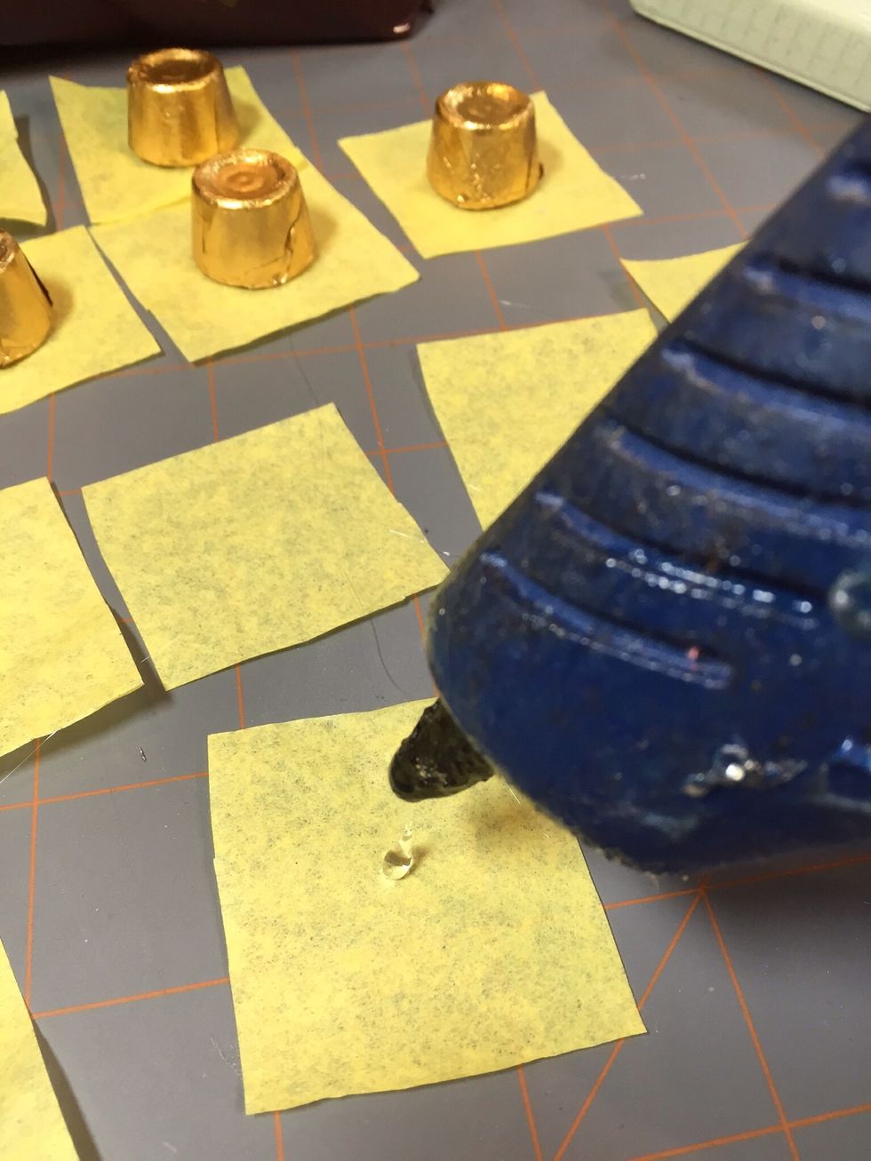 Add a dot of hot glue to the middle of tissue paper.....