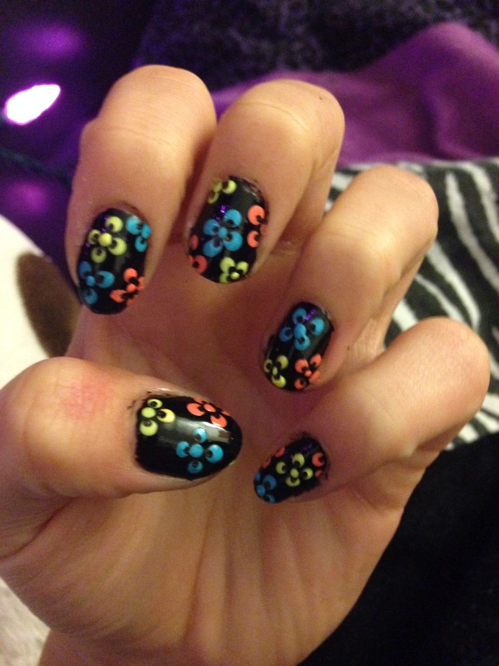 Add a dot of the same colour of the flower in the middle of the flower