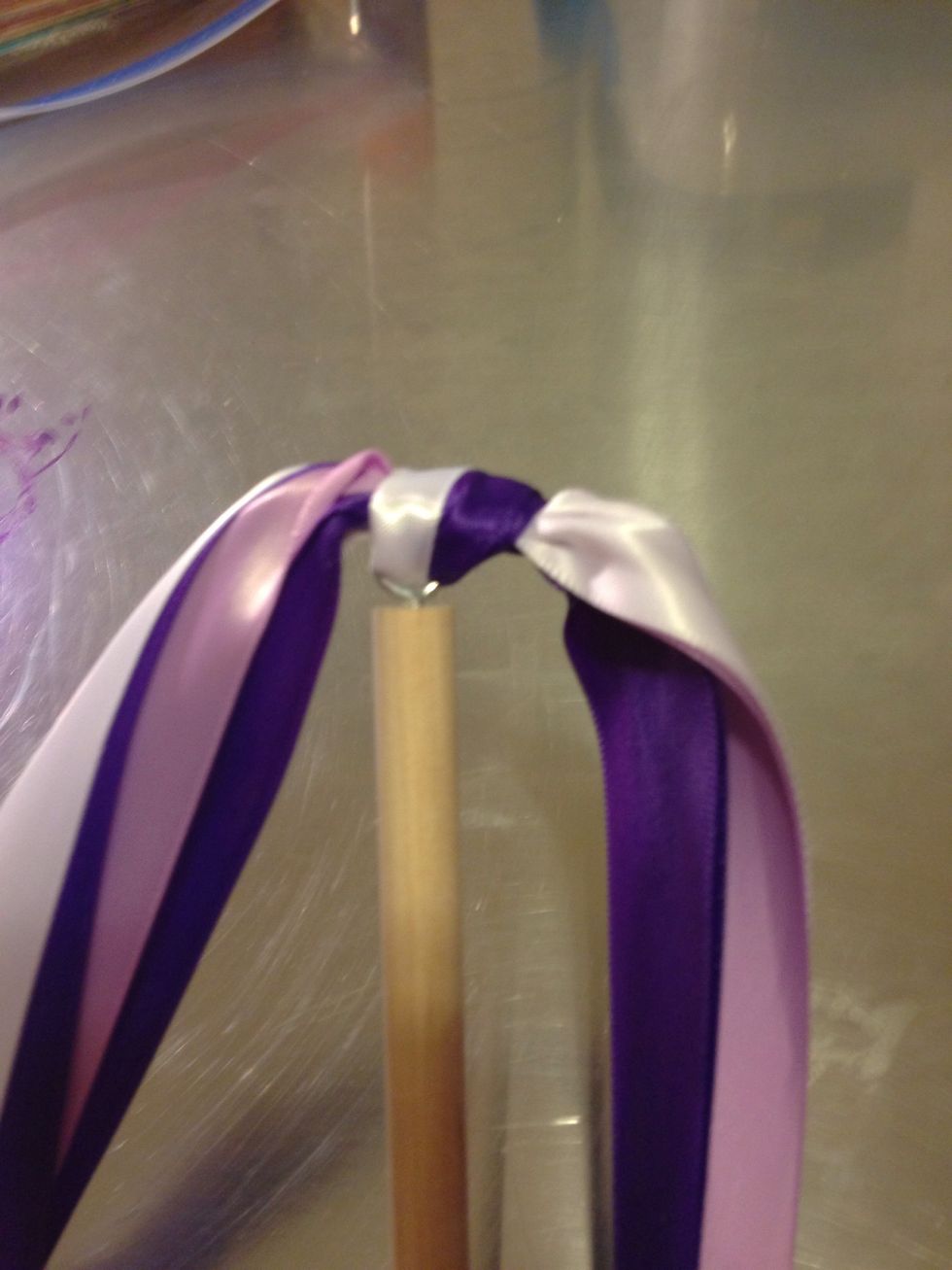 Add a drop or two of hot glue inside the knot on top of the eye screw. Then tighten your knot on the hot glue.