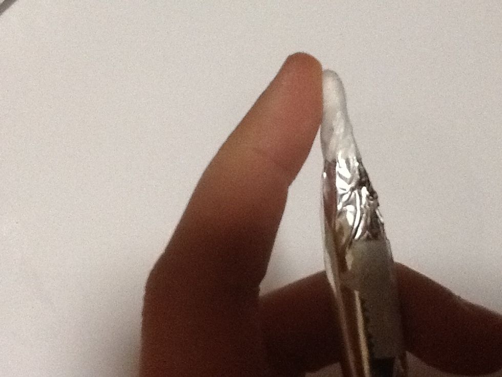Add a droplet of water on your finger and damp the cotton bud to make it work.