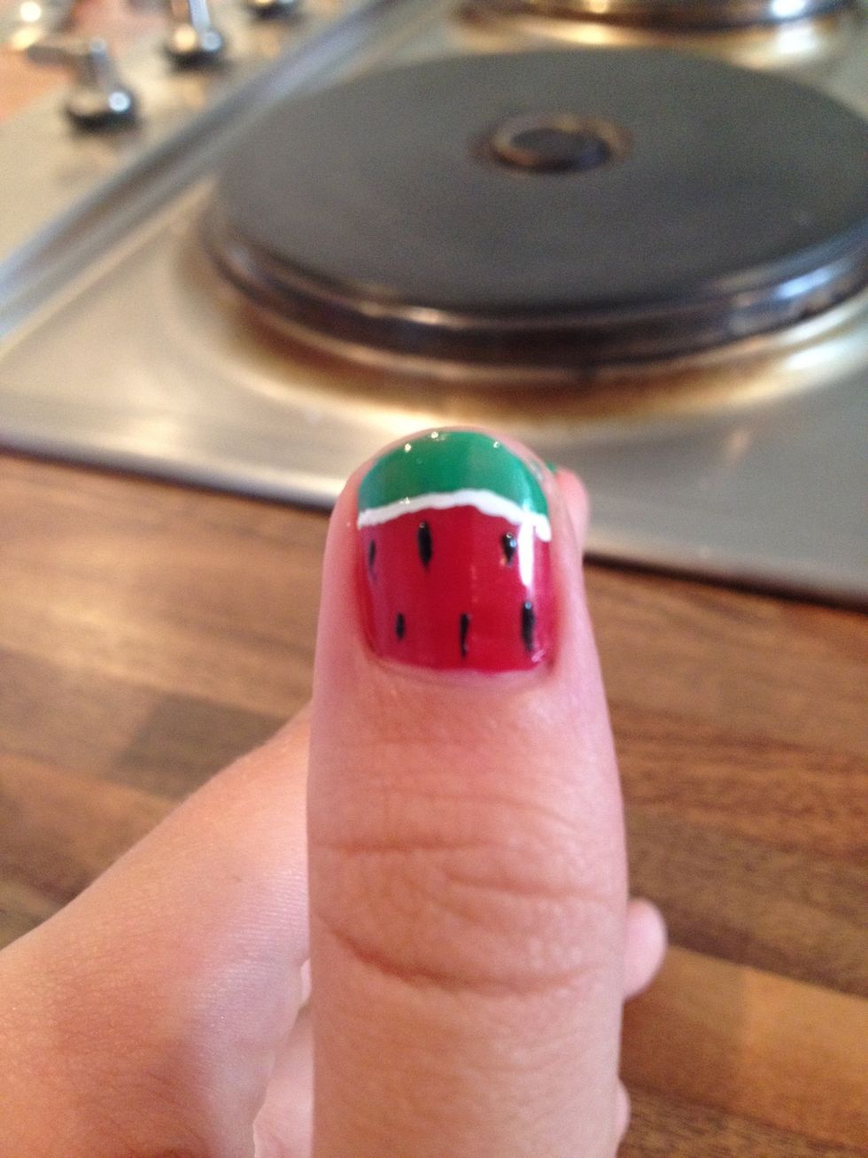 Add a few black dots for seeds. Your cute watermelon nails are now ready!!