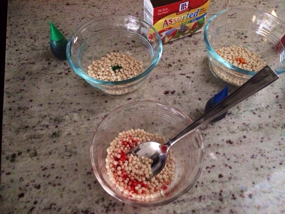 Add a few drops at a time and stir with a spoon until coated and the color depth you want. Use a different spoon for each bowl.