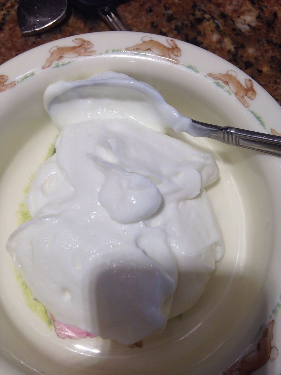 Add a few good spoonfuls of Greek yogurt that is plain to a bowl. If you are in a hurry you can make this in a to go container or a mason jar.