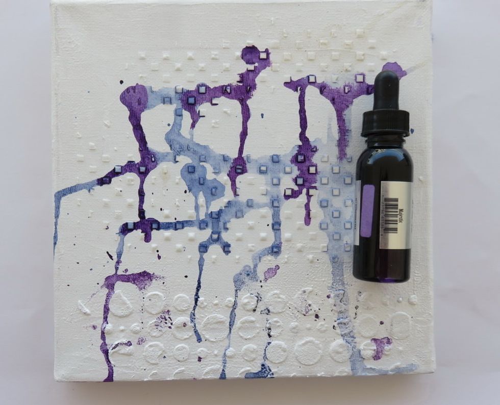 Add a few more drops of Minx-Majestic ink . Move the drops a bit over the canvas.