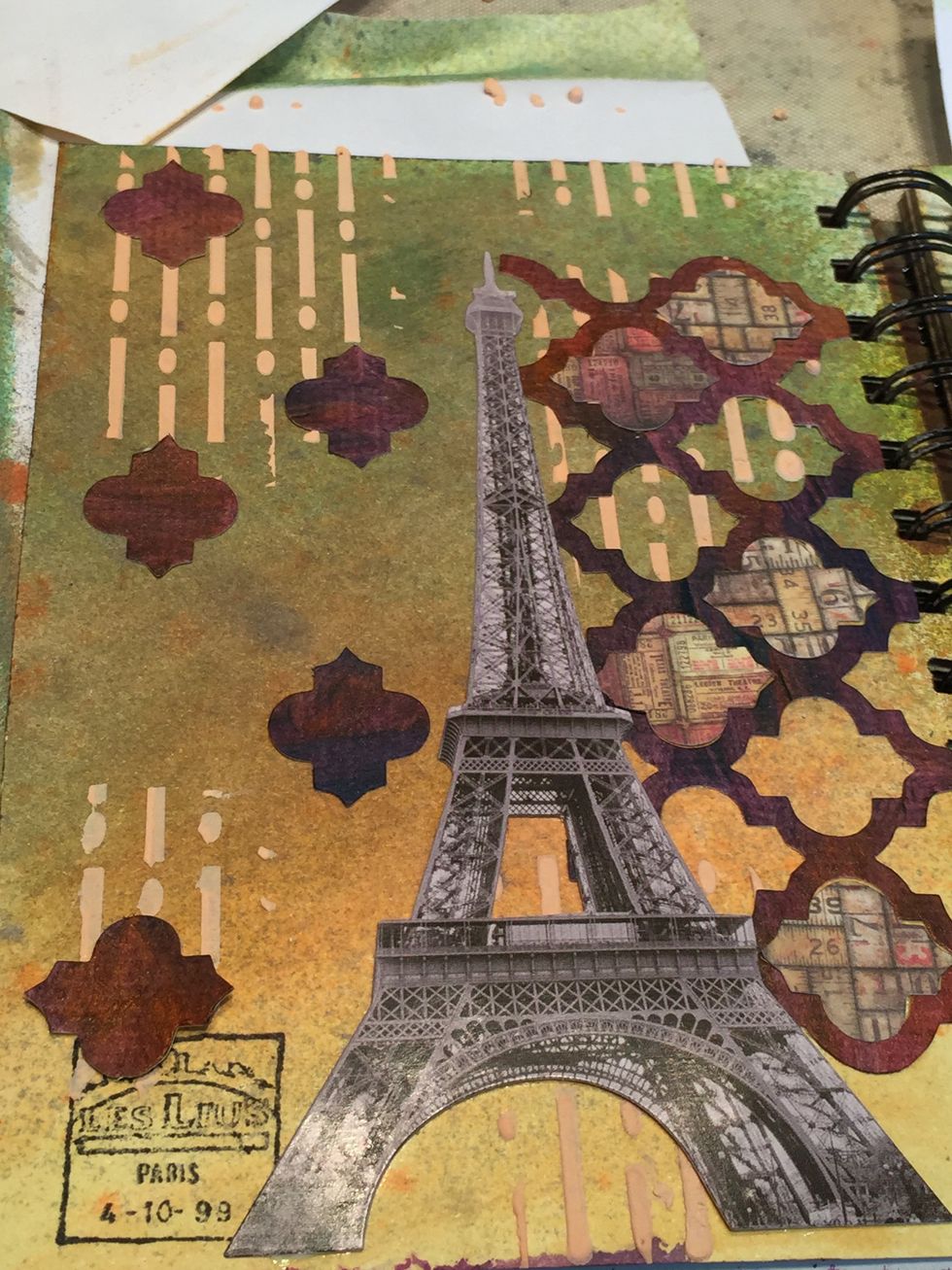Add a few more of the Bristol paper pieces to the left of the Eiffel Tower image.