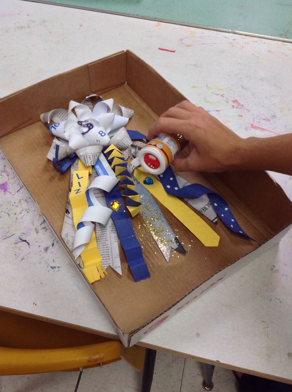 Add a few small designs with glue and use glitter over glitter box!