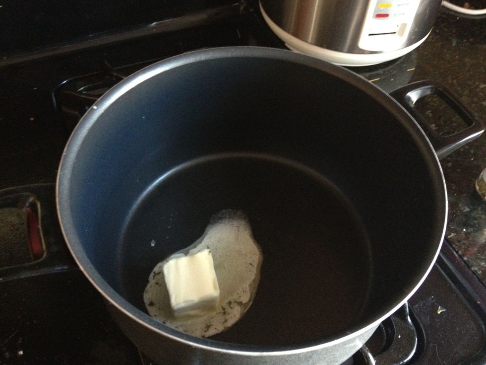 Add a few tablespoons of butter to a large pot.