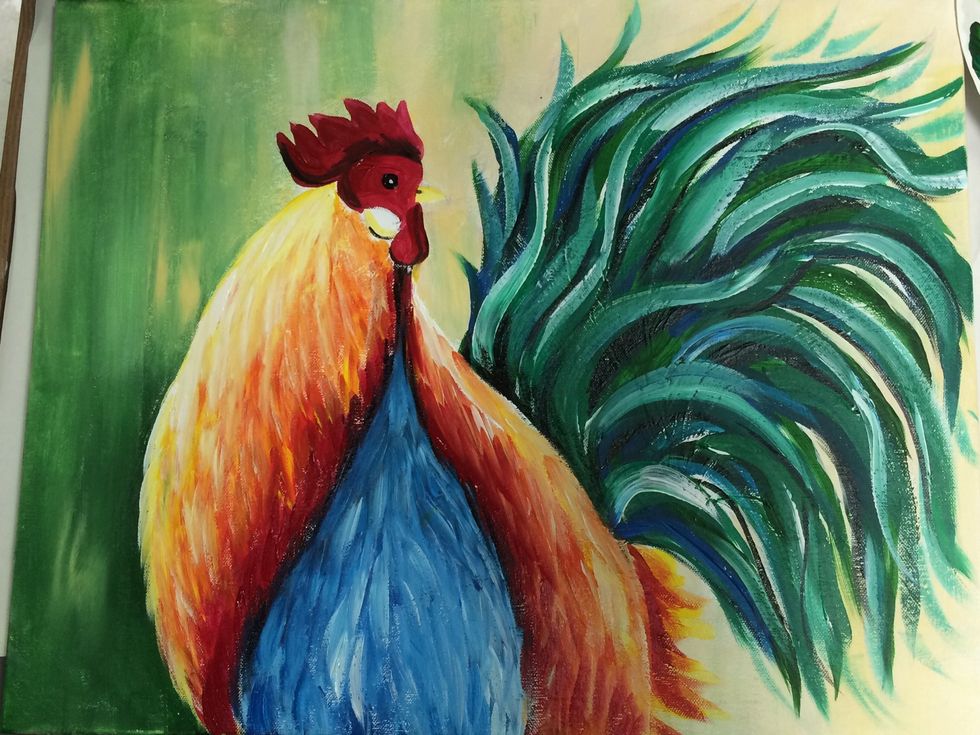 Add a few white strokes over the wings and the little face circle the rooster has. Not sure the scientific term for that.