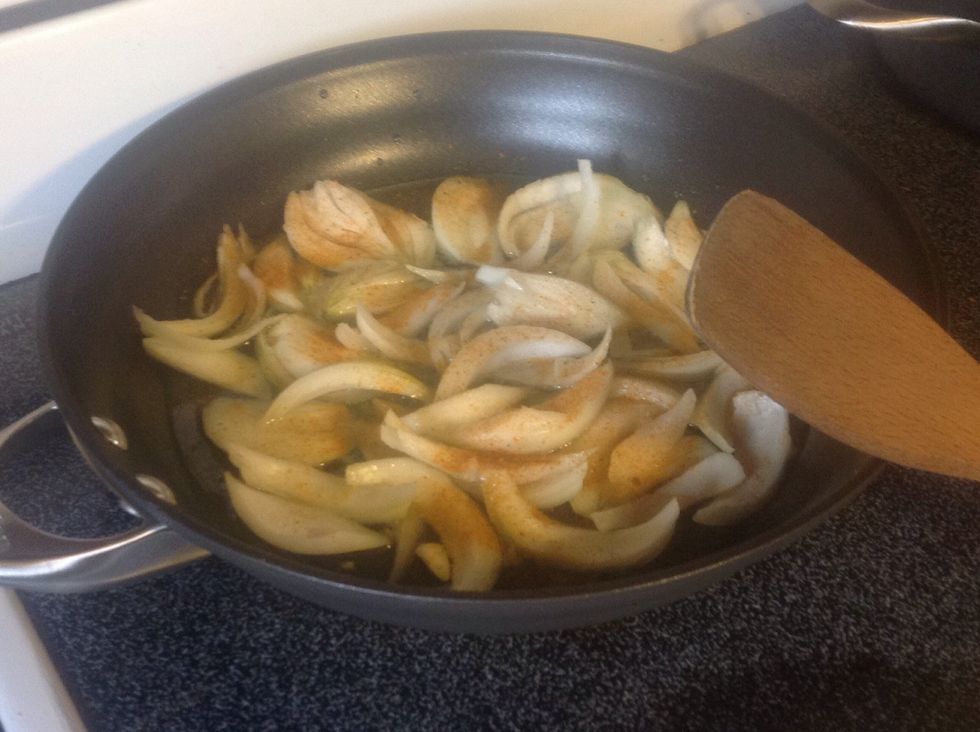 Add a good amount of adobo, shake over entire pan followed by the red pepper and stir often.