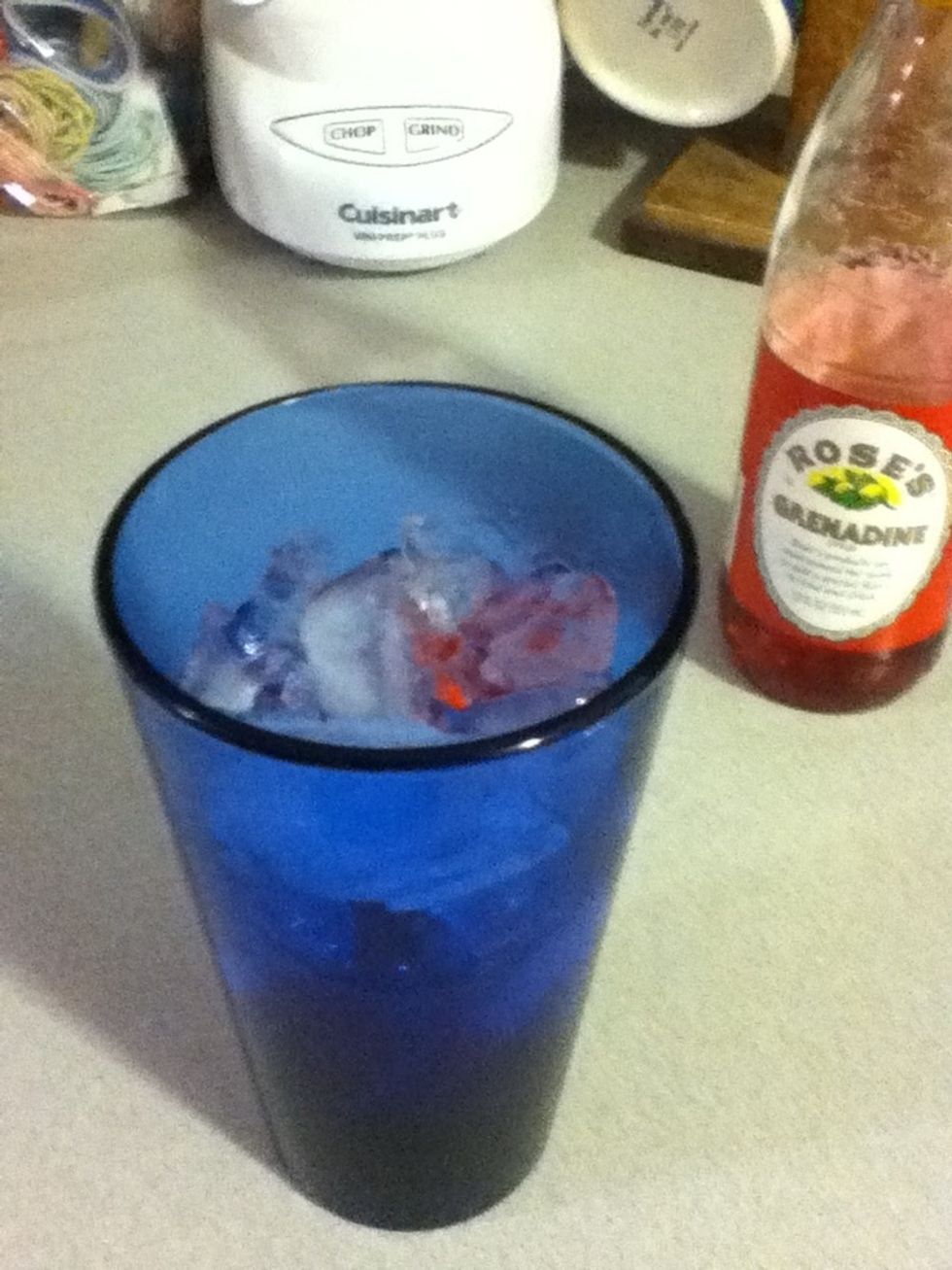 Add a good slug of Grenadine, more than you think you need.