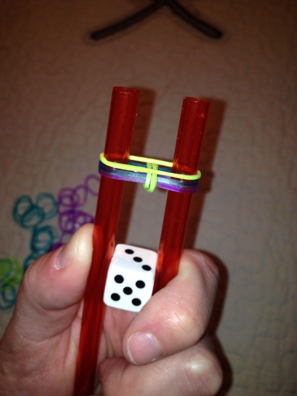 Add a green elastic--whichever is your color that was just brought to the center.