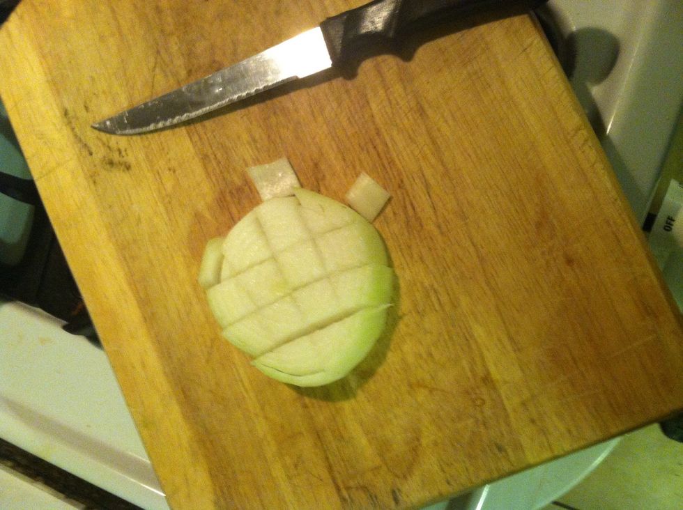 Add a half chopped onion to the chicken.