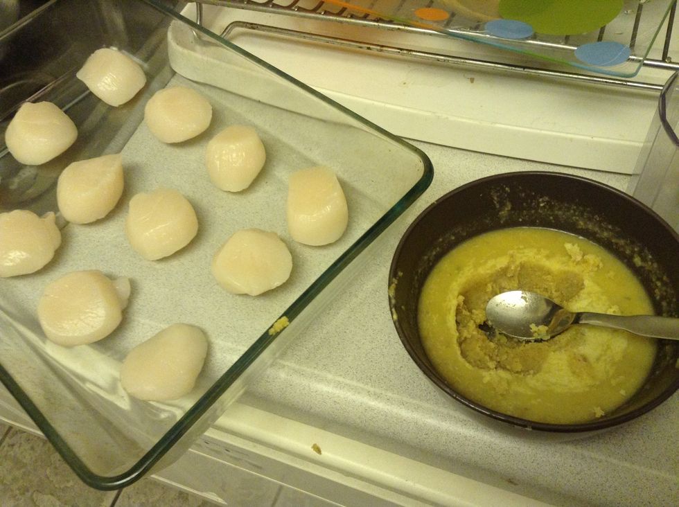 Add a half tea spoon of walnut butter on the top of each scallop