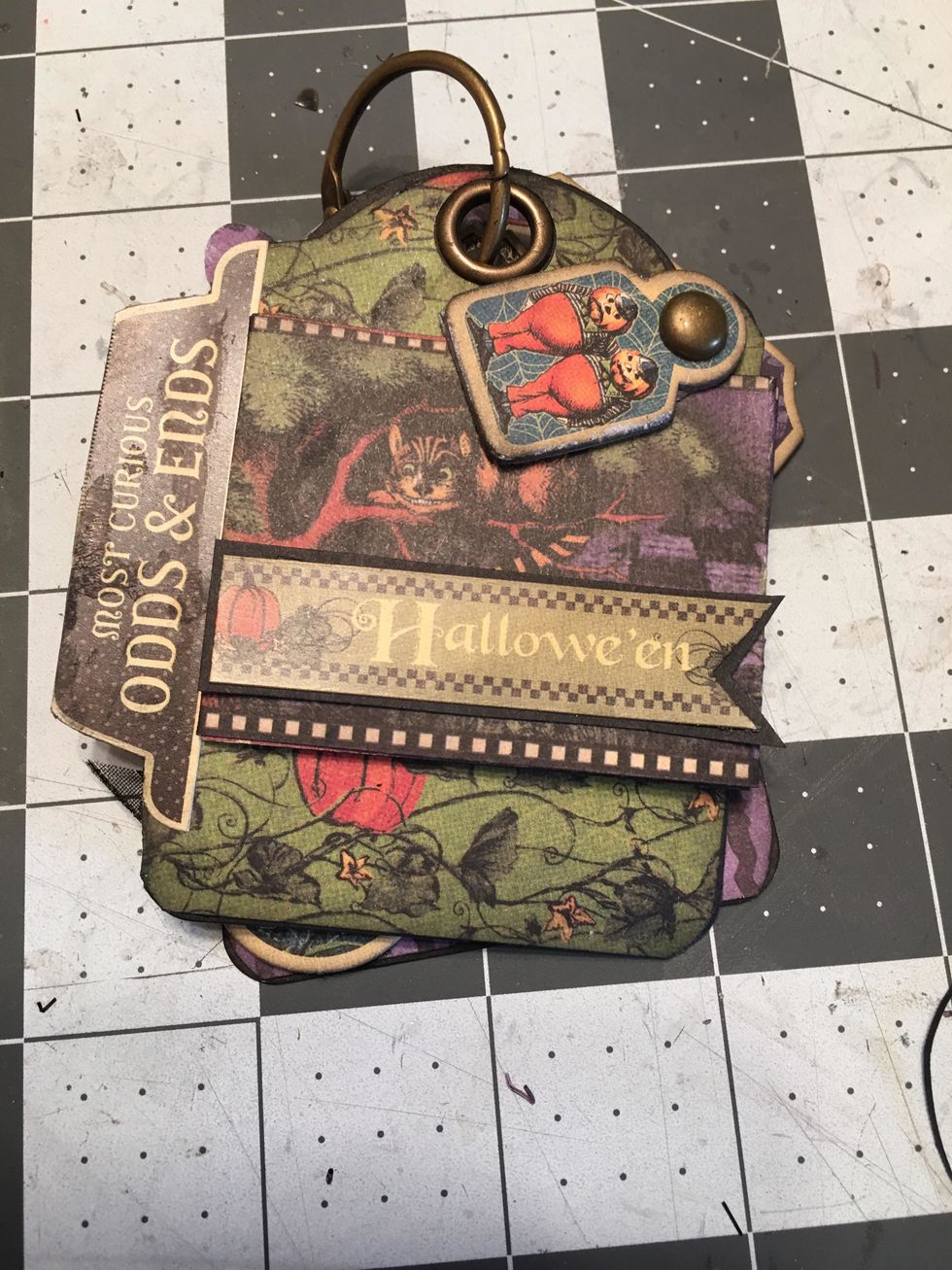 Add a Halloween banner this becomes the front cover of your tag album.