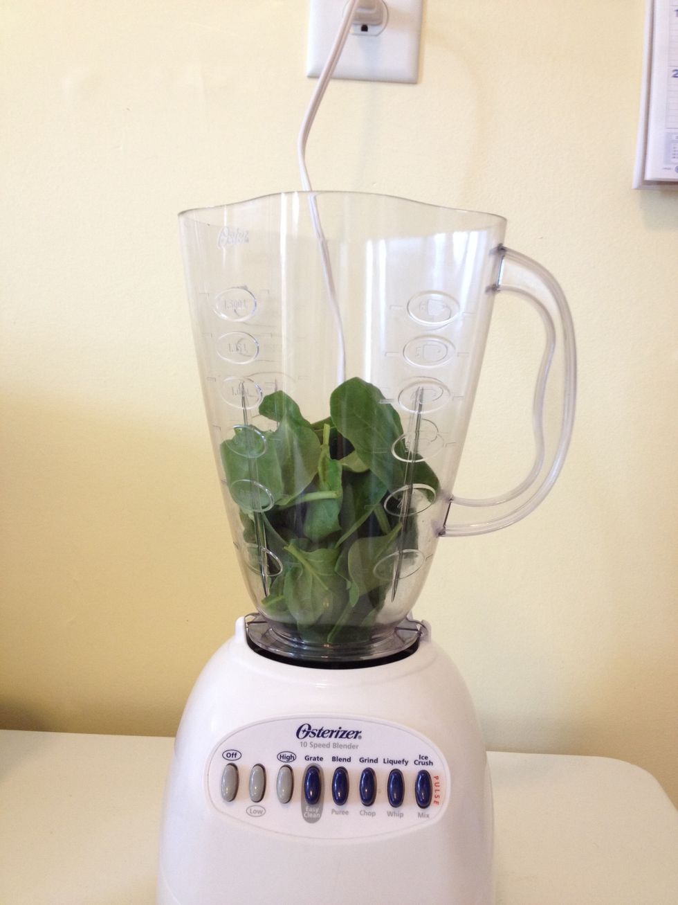 Add a handful of spinach and pulse it so that it is in much smaller pieces.