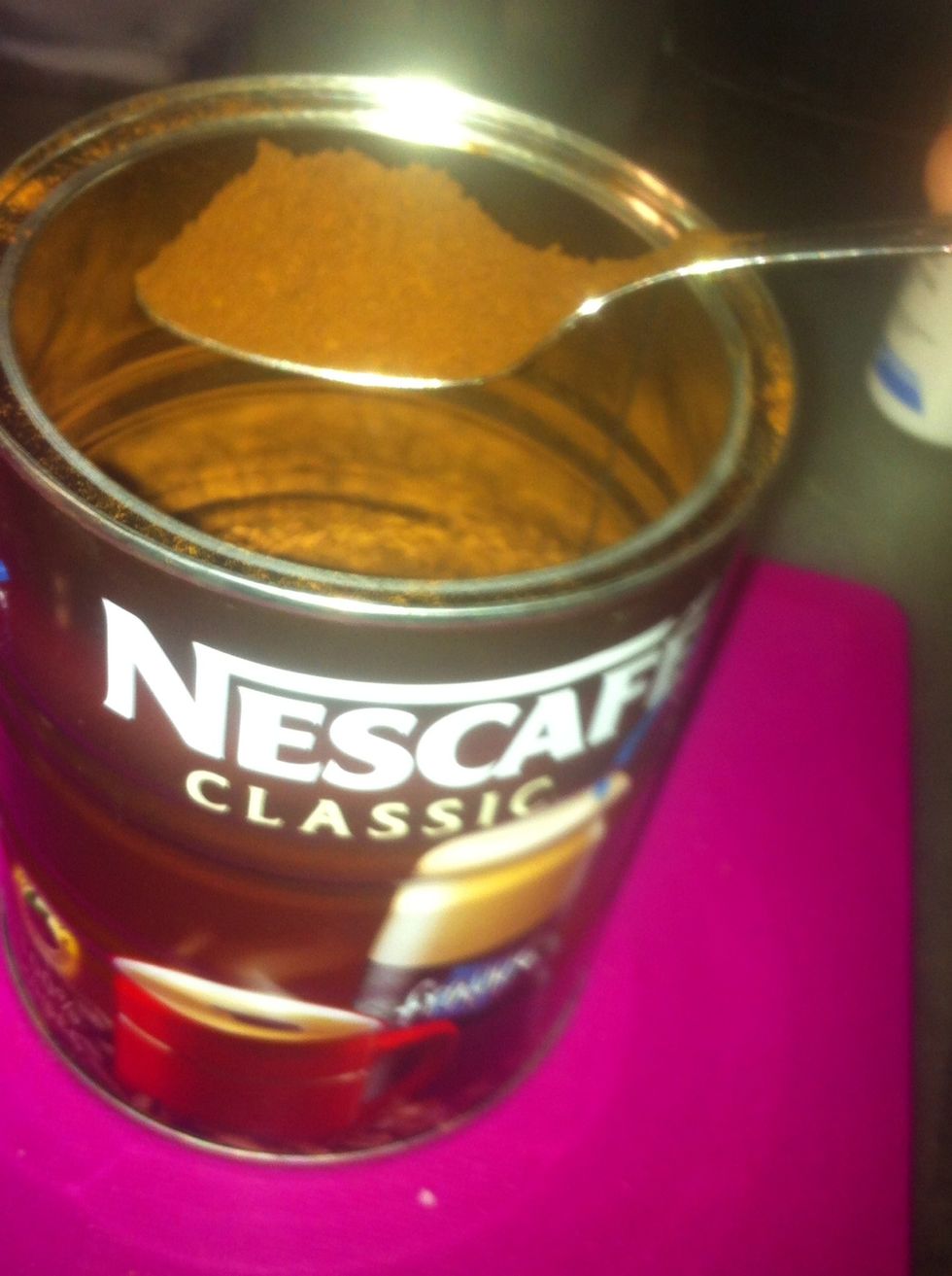 Add a heaping teaspoon of nescafe to your glass.  (maybe a little more depending how strong you like your frappe...)