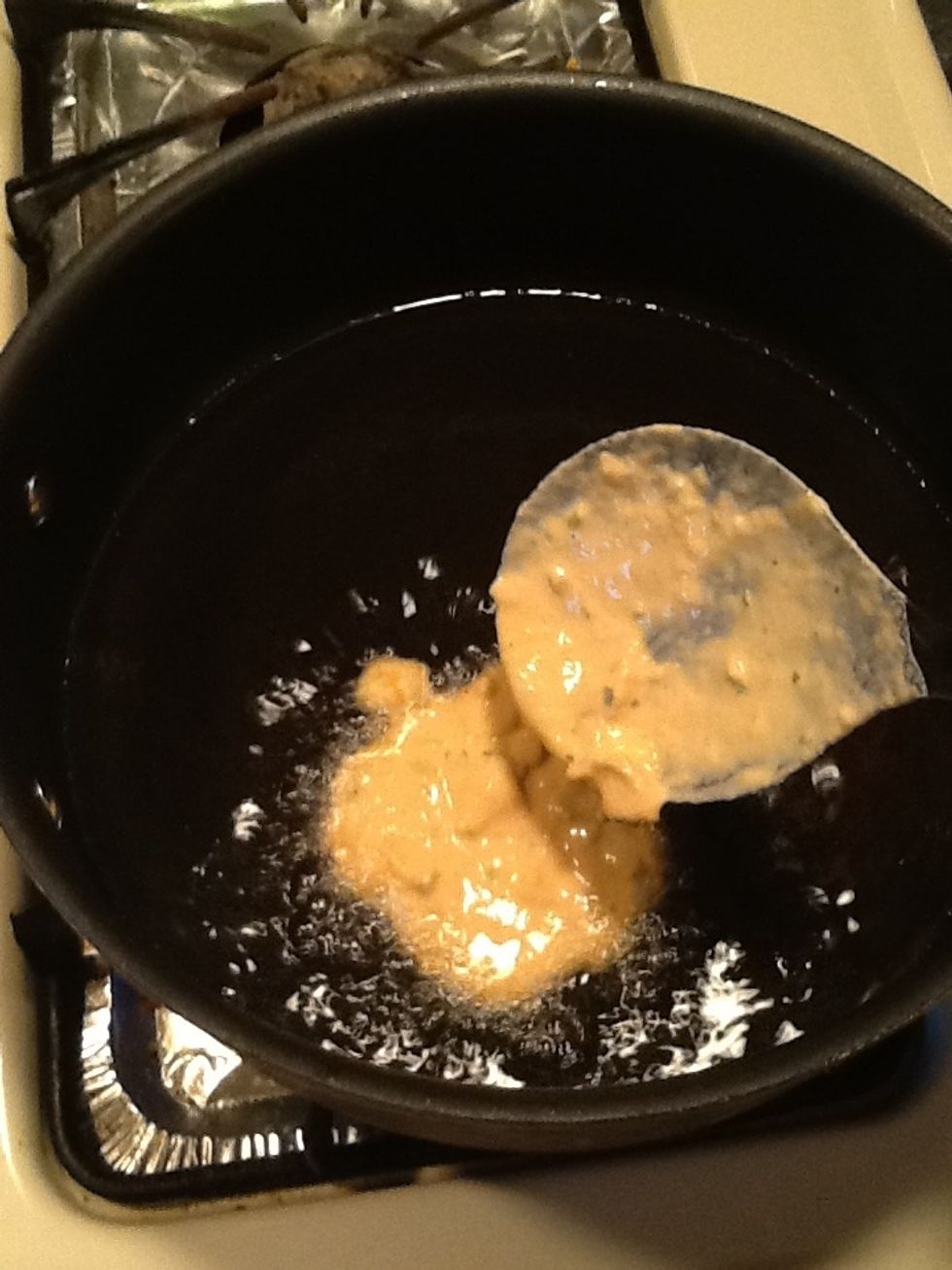 Add a large  tablespoonful to the hot oil. I say about 1/4 cup