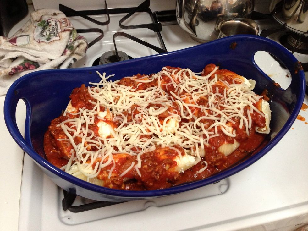 Add a layer of mozzarella cheese on top and then place in a preheated 350 degree oven for 20 minutes.