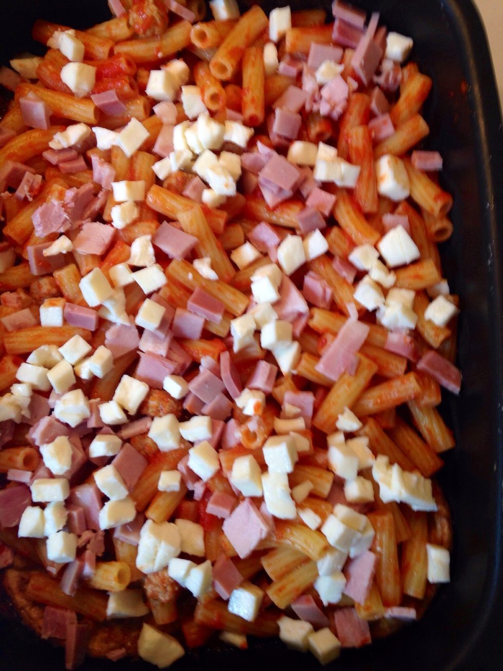 add a layer of pasta, other sauce and a mix of provola ham and mortadella. Repeat the layers until you end ingredients finishing with aubergines and tomato sauce