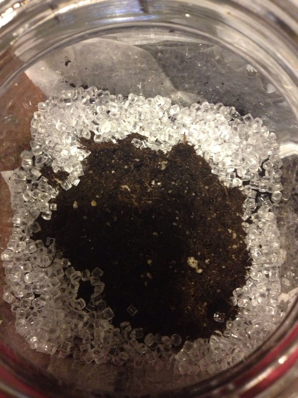 Add a layer of soil on top of the charcoal and push it down. The soil was $2 for a bag that lasted for about 11 jars. Add a layer of glass beads or sand if desired- only around the edge.