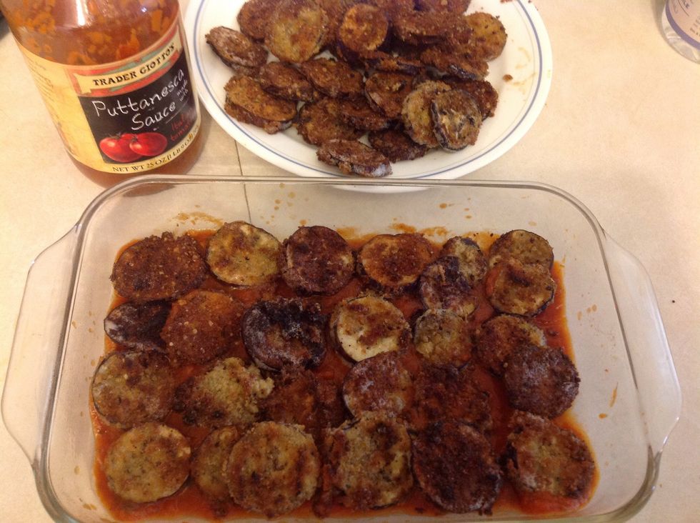 Add a layer of the fried eggplant.