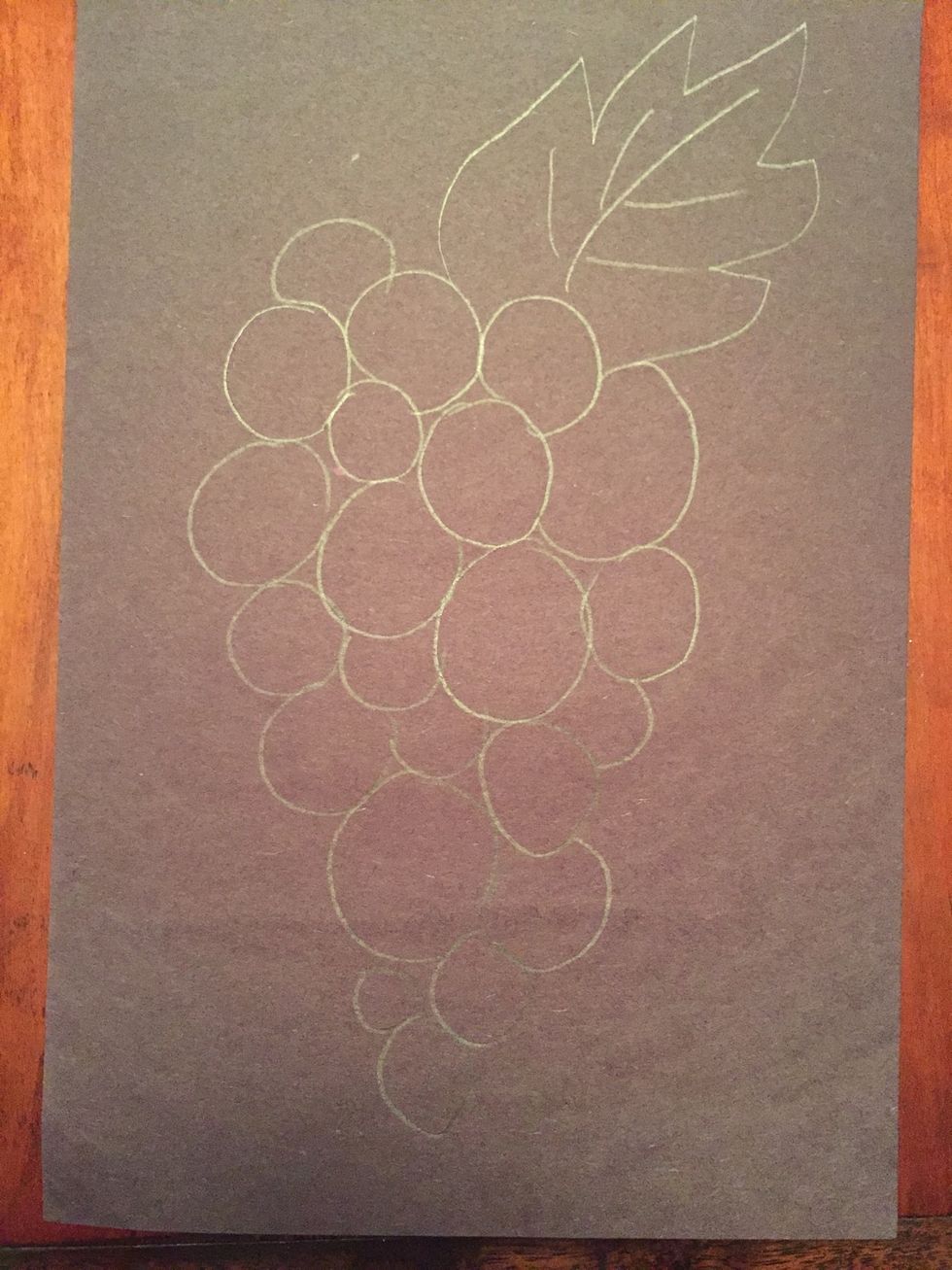 Add a leaf. Your leaf can be anywhere as long as it is attached to your grapes.