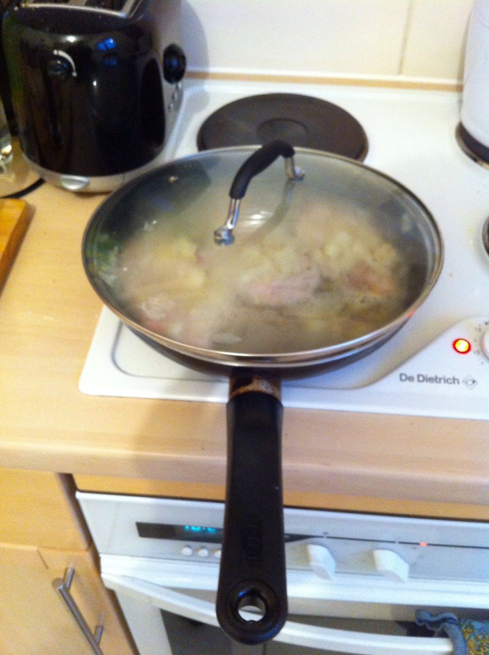 Add a lid to your pan and allow the wine to simmer for approx 20mins.