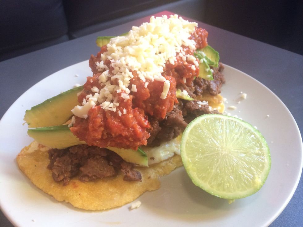 Add a lime to the plate. When eating squeeze some of the lime juice over the dish.