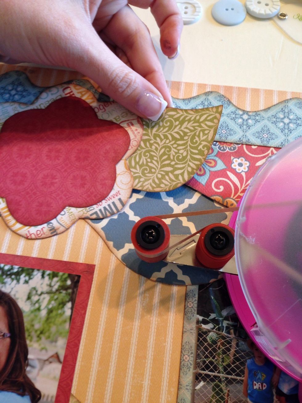 Add a little adhesive to the back of your accessories and place them down, or if needed tuck them in.