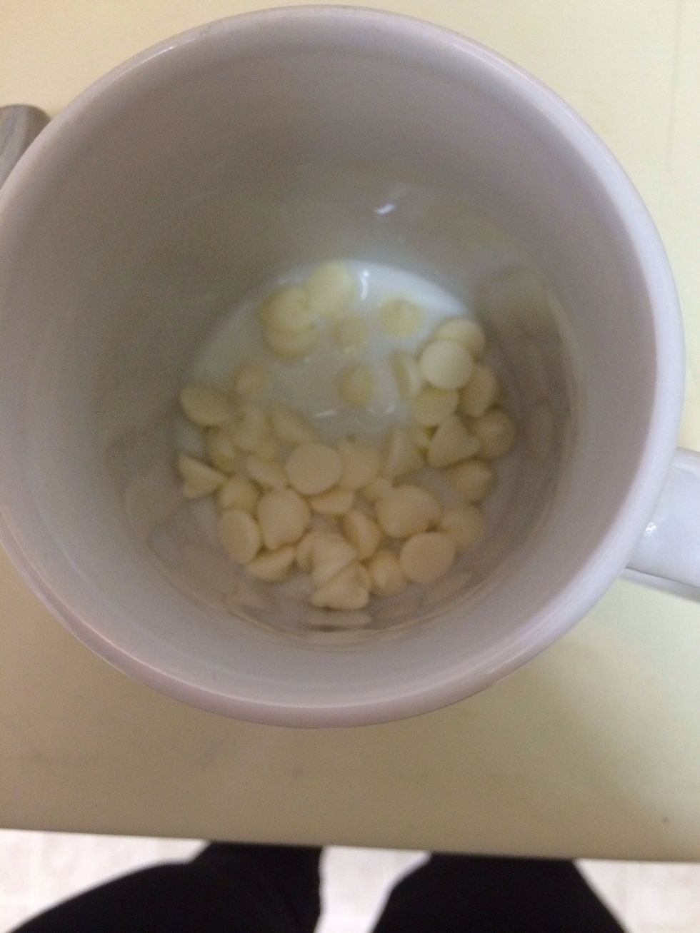 Add a little bit of milk to the chips, enough to help them melt!