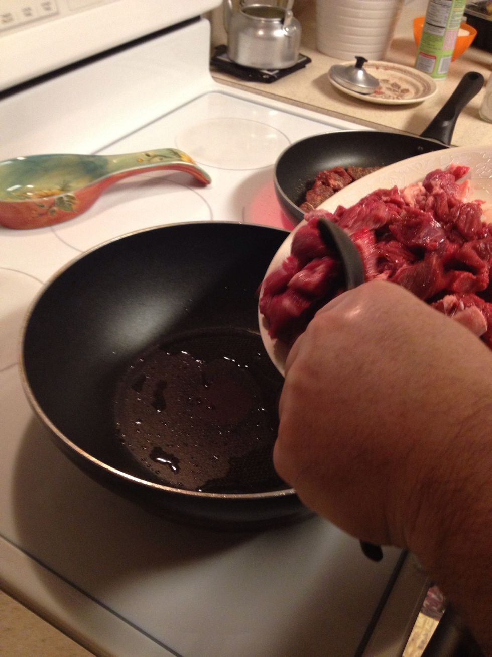 Add a little bit of oil Into the pan on a medium fire. Add the meat