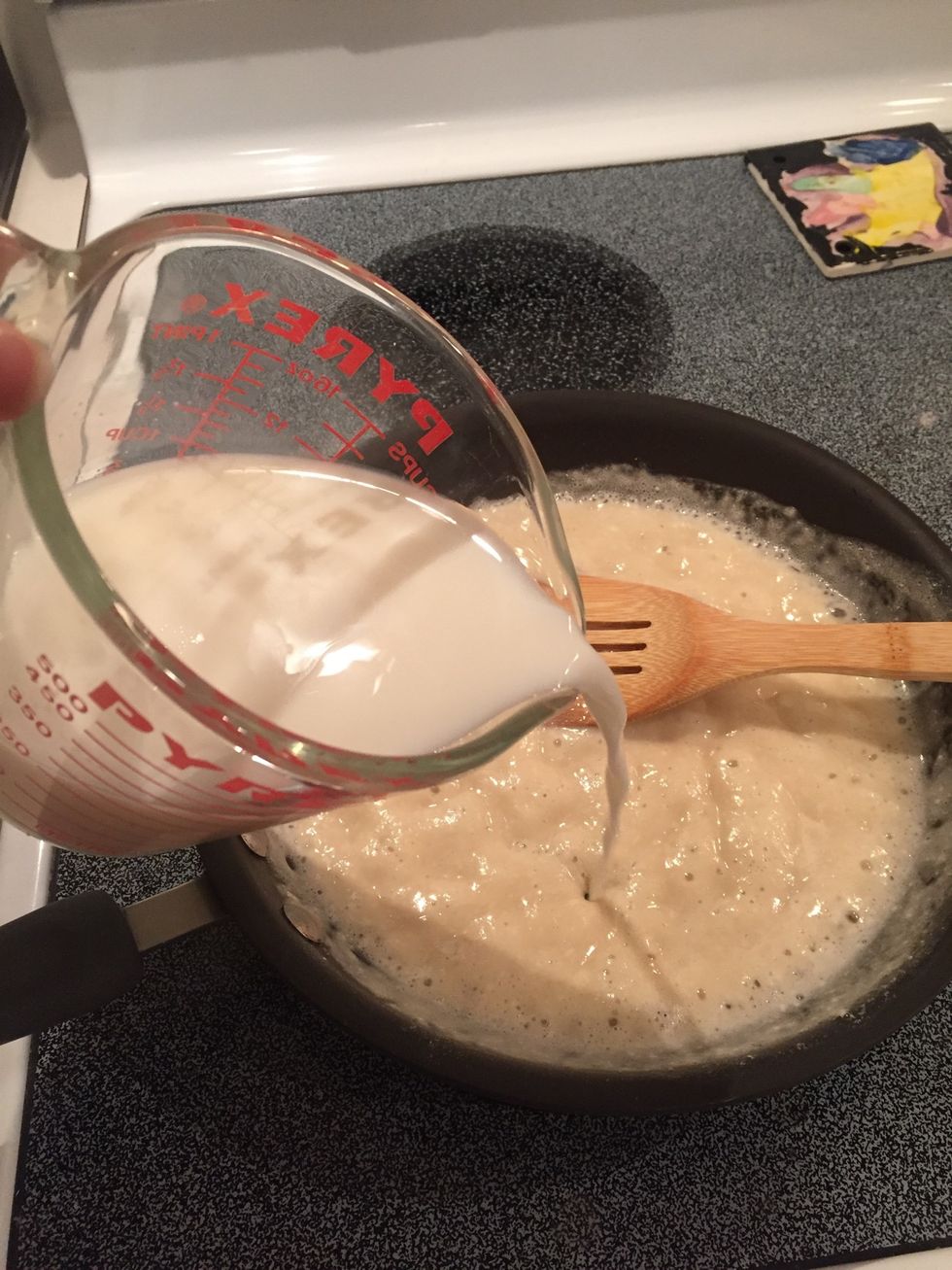 Add a little bit of the milk and whisk with your spoon. (I didn't use a real whisk because I didn't want the metal whisk to ruin my non-stick pan.)