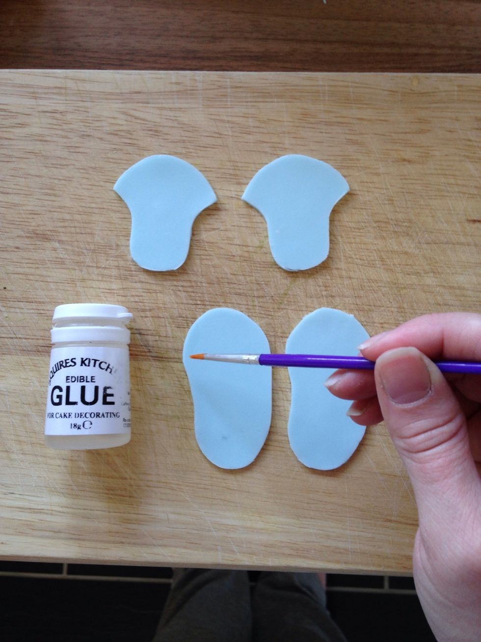 Add a little glue to the front of the toe and stick the tongue piece on, lift the toe part to give it a bit of a body