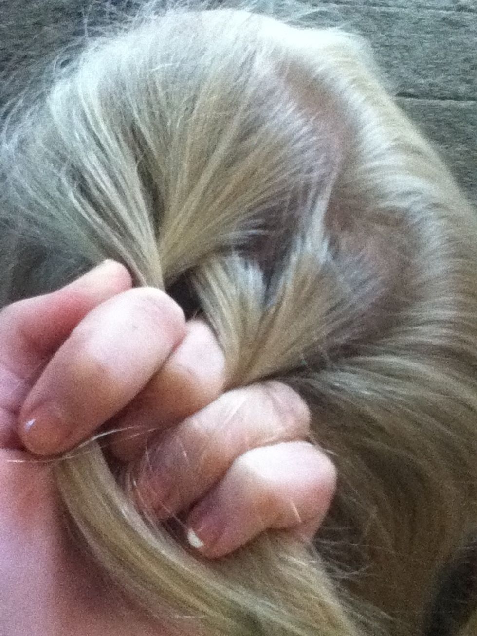 Add a little piece of hair to the right piece and then cross over.