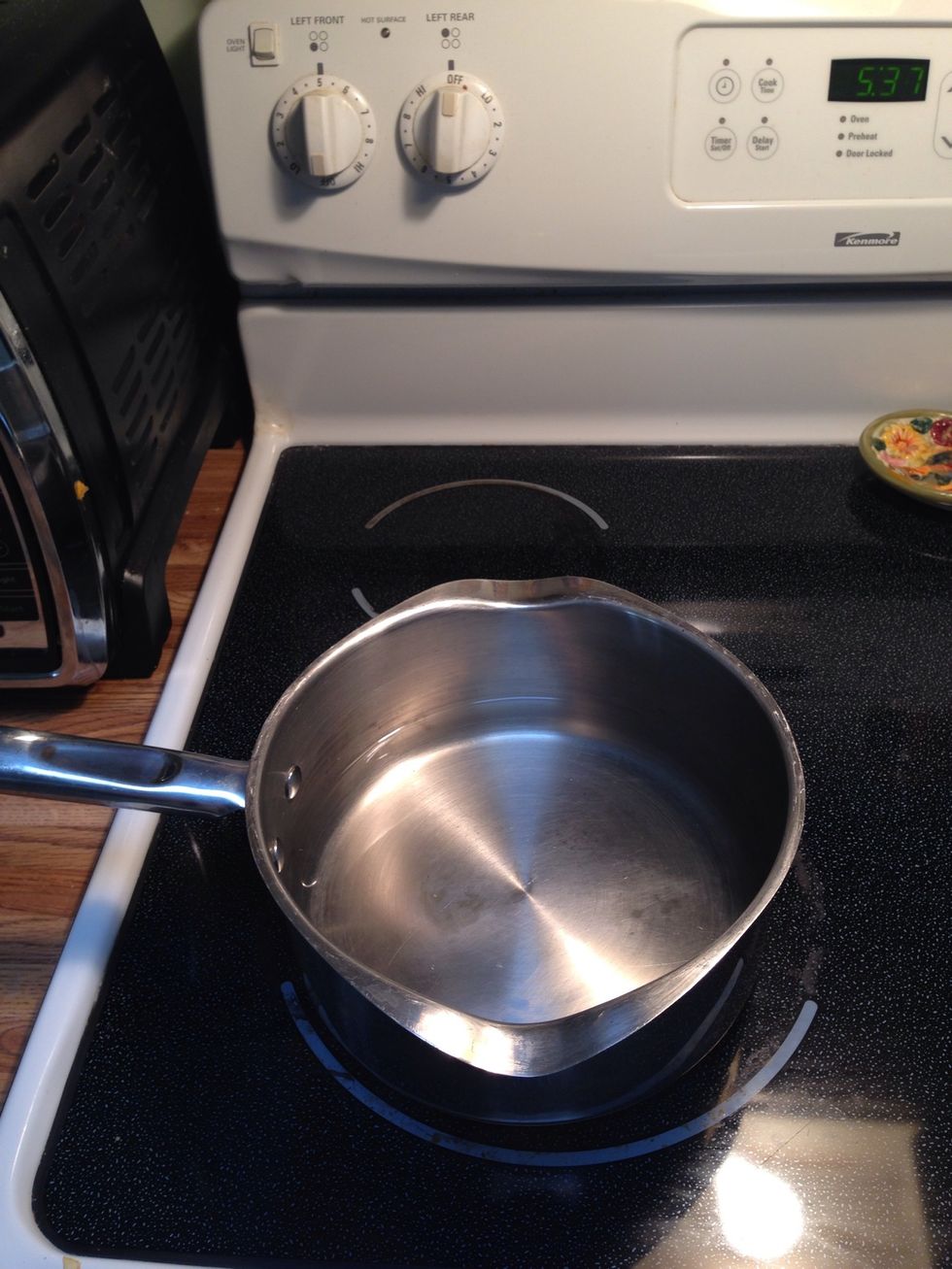 Add a little water to your pan and set to simmer, you don't want the water to boil, that would be to hot!