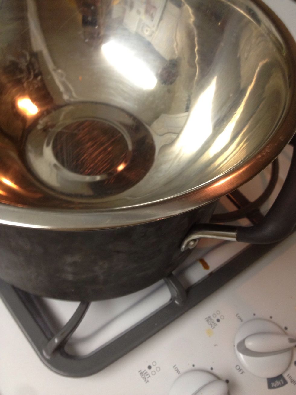 add a metal bowl on top! Don't add the bowl until after the water is boiling - when you put the bowl on top, reduce the heat to slowly melt the soy flakes.