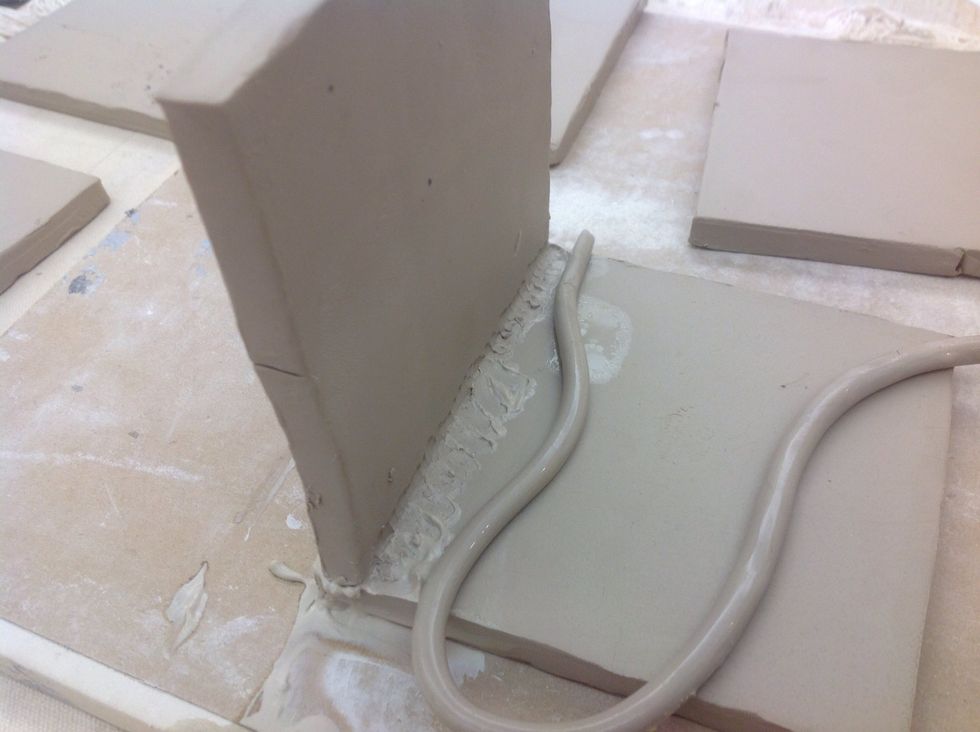 Add a moist snake of clay to the joint do the two pieces.