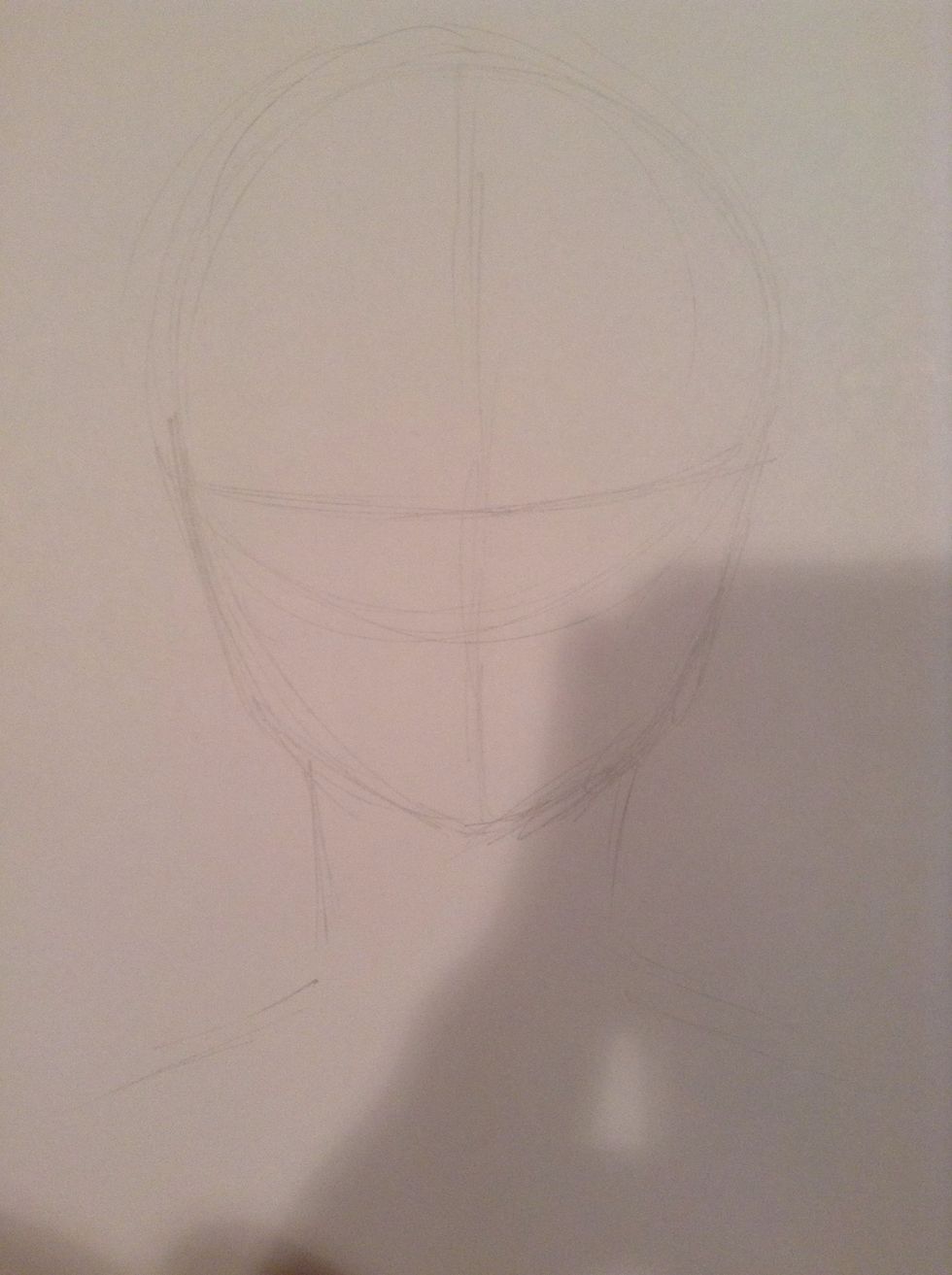 Add a neck. It shouldn't just be two straight lines coming out of the chin. They should be slightly curved, and, because we are drawing a girl, the neck should be slender.
