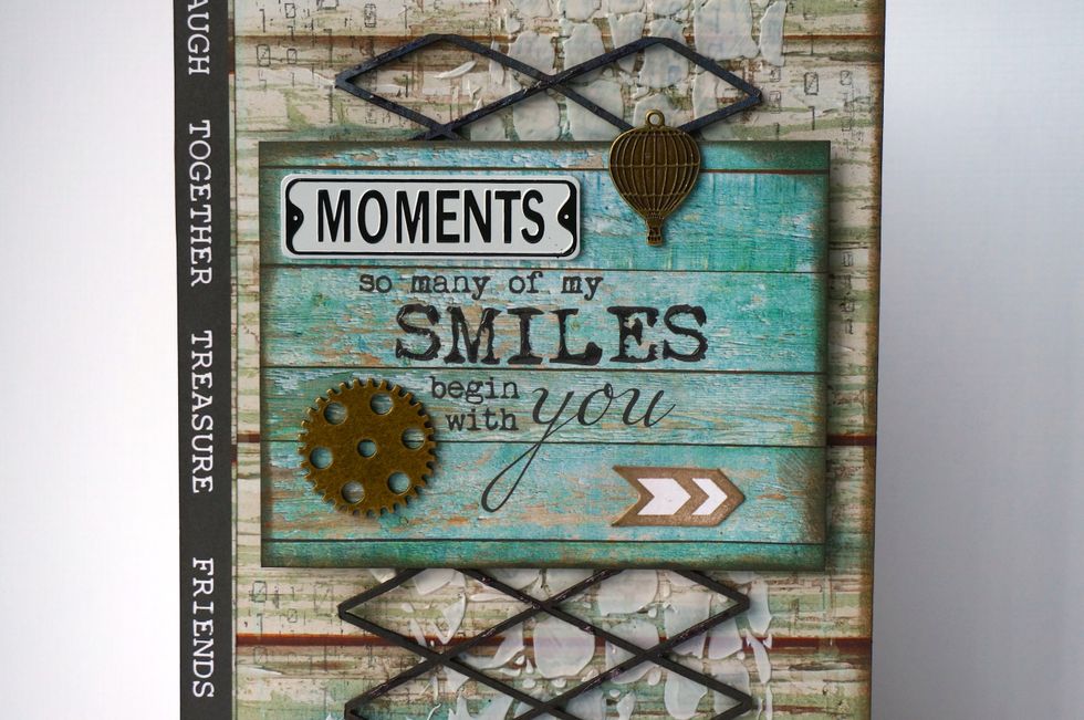 Add a number of embellishments to your title piece. I used metal gadgets from the kit, and inked the edges of everything :-)