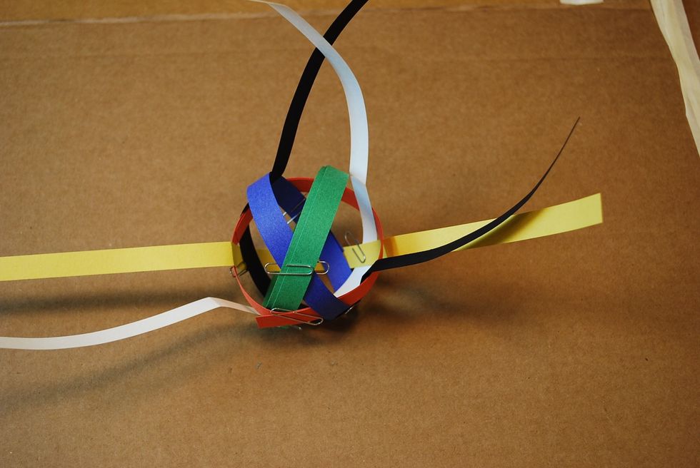 Add a paper clip to hold together the blue and green loops.