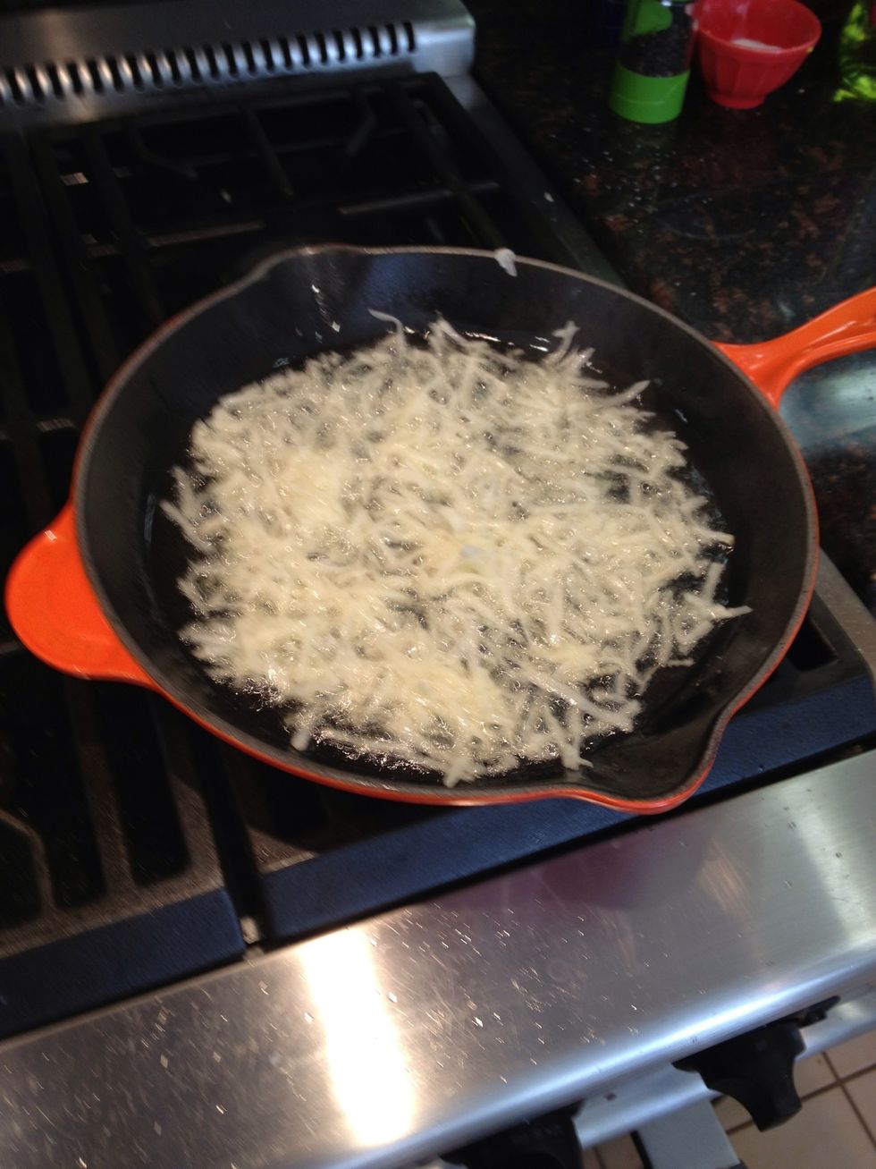 Add a paper-thin layer of the sweet potato to a saucepan of grapeseed oil. Let them get crispy, then flip. Remove when both sides are crispy. Do the same for the Russet potato.