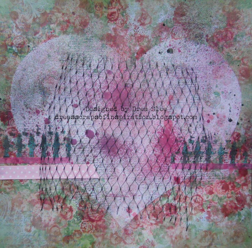 Add a piece of black netting to the center of the heart overhanging along the bottom. My netting is from fruit net bags.