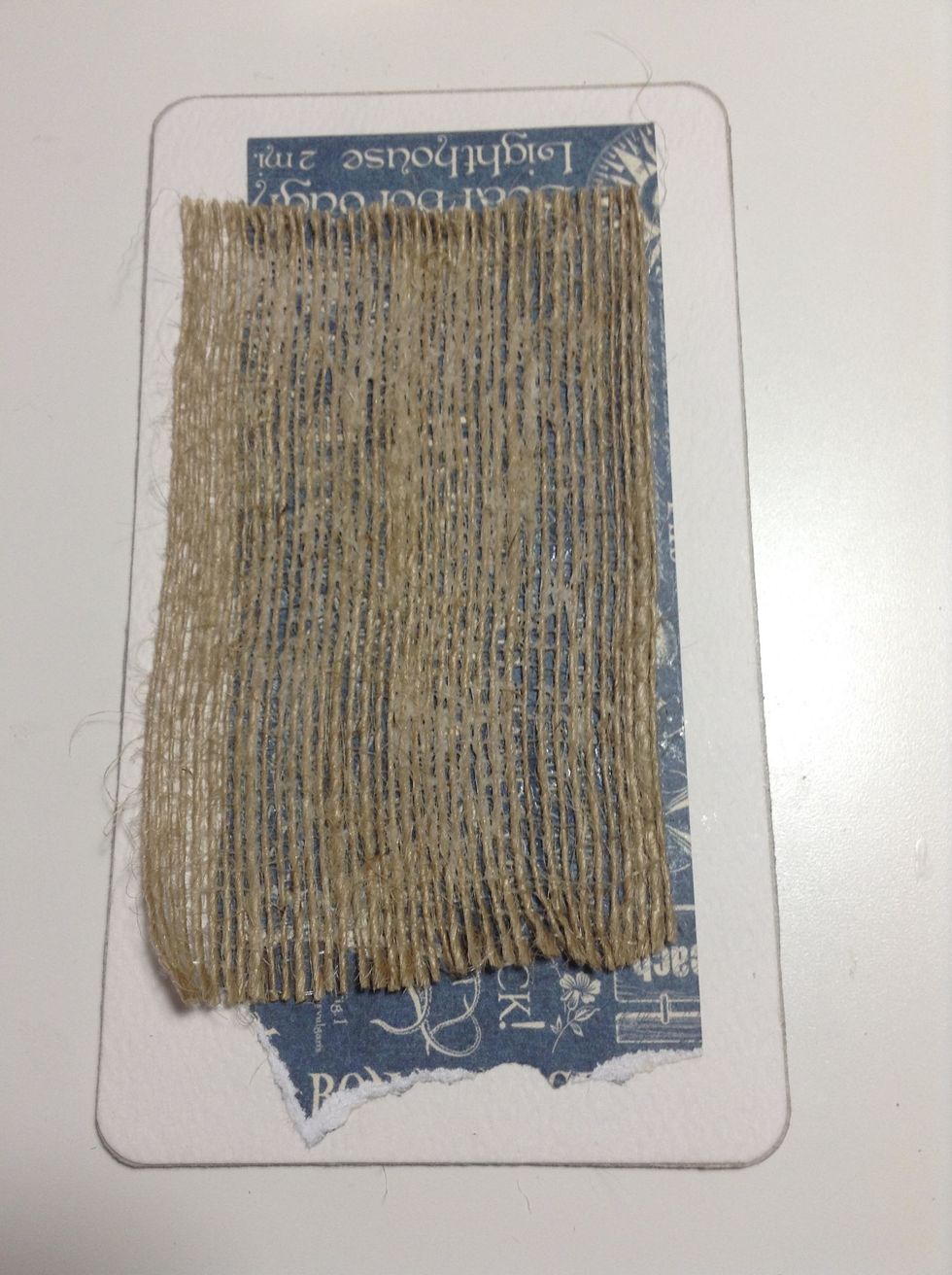 Add a piece of burlap to the front cover.