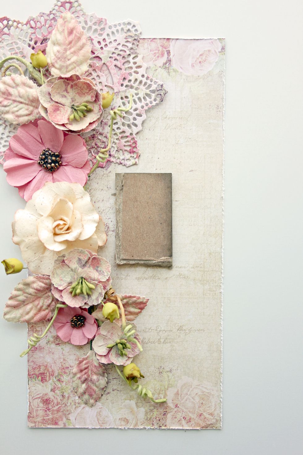 Add a piece of cardboard, cut just a bit smaller than the stamped sentiment, slightly to the right of the center of the card base.