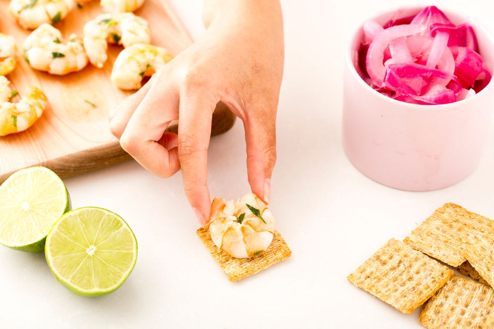Add a piece of shrimp to a TRISCUIT Cracker.