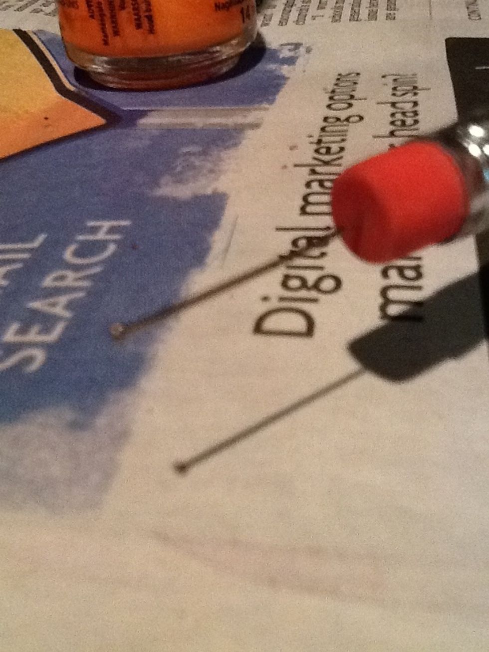 Add a pin to a pencil eraser. And have the sharp point of the pin in the eraser so the rounded part of the pin is sticking out.